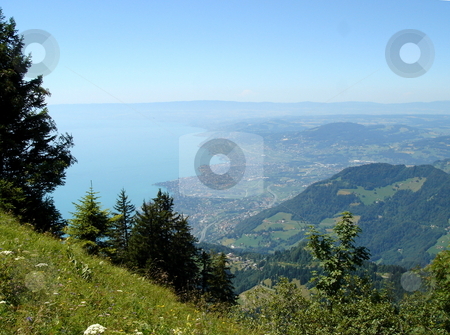 To use this stock image in your creative project, please select the size you need over to the right and click the "Add to Cart" button.
Your downloaded image will come with the Cutcaster watermark removed so don’t worry about the watermark you see on this page. View of Montreux from the mountain stock photo, View of Montreux, Switzerland, and the lake of Geneva from the Alps mountain with its fir trees by beautiful weather by Elenarts
