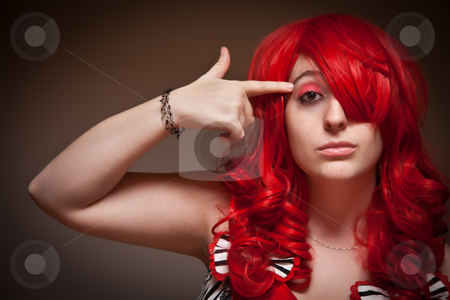 To use this stock image in your creative project, please select the size you need over to the right and click the "Add to Cart" button.
Your downloaded image will come with the Cutcaster watermark removed so don’t worry about the watermark you see on this page. Attractive Young Red Haired Woman with Hand To Her Head stock photo, Portrait of an Attractive Red Haired Woman with Hand in the Shape of a Gun to Her Head on a Grey Background. by Andy Dean