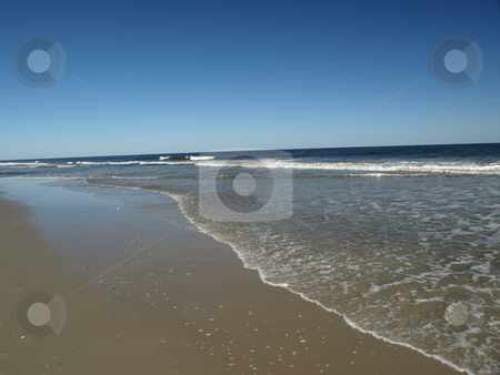 To use this stock image in your creative project, please select the size you need over to the right and click the "Add to Cart" button.
Your downloaded image will come with the Cutcaster watermark removed so don’t worry about the watermark you see on this page. Carolina shore stock photo, Along the shore in North Carolina. A view of the beach by Tim Markley