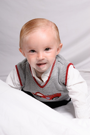 To use this stock image in your creative project, please select the size you need over to the right and click the "Add to Cart" button.
Your downloaded image will come with the Cutcaster watermark removed so don’t worry about the watermark you see on this page. Handsome Toddler stock photo, A child portrait of ahandsome toddler dressed in nice clothing and is crawling and smiling at the viewer by Richard Nelson