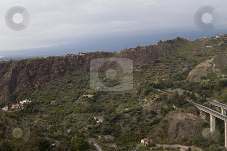 To use this stock image in your creative project, please select the size you need over to the right and click the "Add to Cart" button.
Your downloaded image will come with the Cutcaster watermark removed so don’t worry about the watermark you see on this page. Tier Hills stock photo, Looking over the overcast hills of Messina, Italy by Kevin Tietz