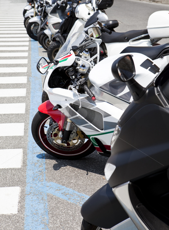 To use this stock image in your creative project, please select the size you need over to the right and click the "Add to Cart" button.
Your downloaded image will come with the Cutcaster watermark removed so don’t worry about the watermark you see on this page. Row of motorbikes stock photo, Row of parked motorbikes by Anne-Louise Quarfoth