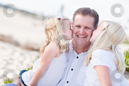 To use this stock image in your creative project, please select the size you need over to the right and click the "Add to Cart" button.
Your downloaded image will come with the Cutcaster watermark removed so don’t worry about the watermark you see on this page. Handsome Dad Getting Kisses from His Cute Daughters stock photo, Handsome Dad Getting Kisses from His Cute Daughters at The Beach. by Andy Dean