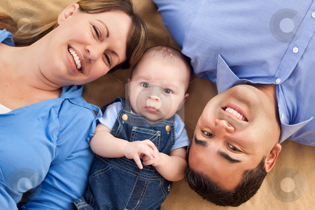 To use this stock image in your creative project, please select the size you need over to the right and click the "Add to Cart" button.
Your downloaded image will come with the Cutcaster watermark removed so don’t worry about the watermark you see on this page. Mixed Race Family Playing on the Blanket stock photo, Mixed Race Family Playing Face Up on the Blanket. by Andy Dean