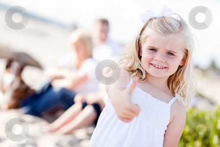 To use this stock image in your creative project, please select the size you need over to the right and click the "Add to Cart" button.
Your downloaded image will come with the Cutcaster watermark removed so don’t worry about the watermark you see on this page. Adorable Little Blonde Girl with Thumbs Up At the Beach stock photo, Adorable Little Blonde Girl with Thumbs Up At the Beach with Her Family. by Andy Dean