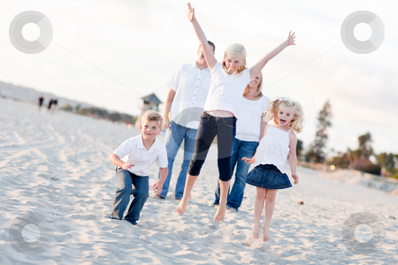 To use this stock image in your creative project, please select the size you need over to the right and click the "Add to Cart" button.
Your downloaded image will come with the Cutcaster watermark removed so don’t worry about the watermark you see on this page. Happy Sibling Children Jumping for Joy stock photo, Happy Sibling Children Jumping for Joy at the Beach as Parents Watch. by Andy Dean