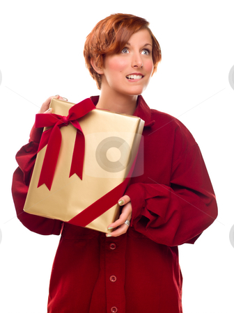 To use this stock image in your creative project, please select the size you need over to the right and click the "Add to Cart" button.
Your downloaded image will come with the Cutcaster watermark removed so don’t worry about the watermark you see on this page. Pretty Red Haired Girl Biting Lip Holding Wrapped Gift stock photo, Pretty Red Haired Girl Biting Her Lip Holding Wrapped Gift Isolated on a White Background. by Andy Dean