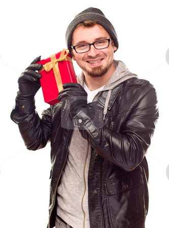To use this stock image in your creative project, please select the size you need over to the right and click the "Add to Cart" button.
Your downloaded image will come with the Cutcaster watermark removed so don’t worry about the watermark you see on this page. Warmly Dressed Young Man Holding Wrapped Gift To His Ear stock photo, Warmly Dressed Handsome Young Man Holding Wrapped Gift To His Ear Isolated on a White Background. by Andy Dean