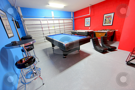 To use this stock image in your creative project, please select the size you need over to the right and click the "Add to Cart" button.
Your downloaded image will come with the Cutcaster watermark removed so don’t worry about the watermark you see on this page. Games Room stock photo, A Games Room with Pool, Air Hockey and Foosball by Lucy Clark