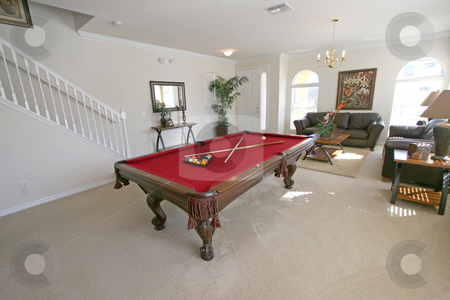 To use this stock image in your creative project, please select the size you need over to the right and click the "Add to Cart" button.
Your downloaded image will come with the Cutcaster watermark removed so don’t worry about the watermark you see on this page. Pool Table stock photo, A Pool Table in a Living Area in a Home by Lucy Clark