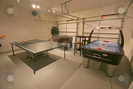 To use this stock image in your creative project, please select the size you need over to the right and click the "Add to Cart" button.
Your downloaded image will come with the Cutcaster watermark removed so don’t worry about the watermark you see on this page. Games Room stock photo, A Games Room with Pool Table, Table Tennis and Foosball. by Lucy Clark