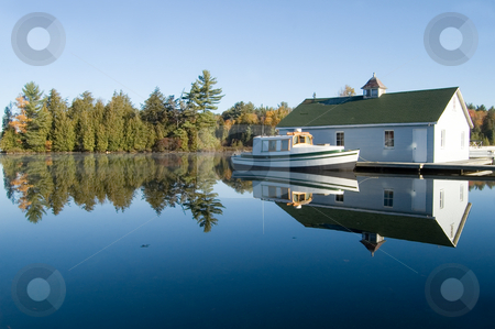 To use this stock image in your creative project, please select the size you need over to the right and click the "Add to Cart" button.
Your downloaded image will come with the Cutcaster watermark removed so don’t worry about the watermark you see on this page. Cottage Country stock photo, Smooth clear lake and fall colors - great cottage country. by Mary Lane