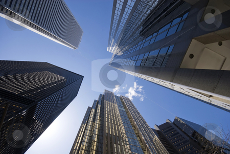 To use this stock image in your creative project, please select the size you need over to the right and click the "Add to Cart" button.
Your downloaded image will come with the Cutcaster watermark removed so don’t worry about the watermark you see on this page. Look WAY Up stock photo, Looking up into the bright blue sky, from amidst a forest of skyscrapers - Toronto, Canada. by Mary Lane