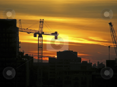 To use this stock image in your creative project, please select the size you need over to the right and click the "Add to Cart" button.
Your downloaded image will come with the Cutcaster watermark removed so don’t worry about the watermark you see on this page. City Sunset stock photo, Construction equipment against the orange clouds of a spectular city sunset. by Mary Lane