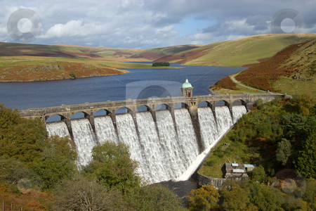 To use this stock image in your creative project, please select the size you need over to the right and click the "Add to Cart" button.
Your downloaded image will come with the Cutcaster watermark removed so don’t worry about the watermark you see on this page. Craig Goch reservoir with water overflowing, Elan Valley, Wales. stock photo, Craig Goch reservoir with water overflowing, Elan Valley, Wales. by Stephen Rees