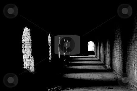 To use this stock image in your creative project, please select the size you need over to the right and click the "Add to Cart" button.
Your downloaded image will come with the Cutcaster watermark removed so don’t worry about the watermark you see on this page. Old dark passage stock photo, An old dark passage with the light coming from the arches by Dario Rota