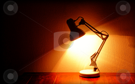 To use this stock image in your creative project, please select the size you need over to the right and click the "Add to Cart" button.
Your downloaded image will come with the Cutcaster watermark removed so don’t worry about the watermark you see on this page. Architect lamp stock photo, Lit architect lamp standing on a table by Kasper Nymann