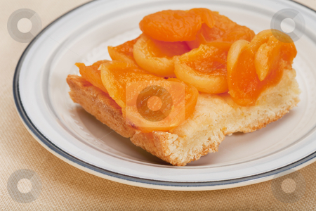 To use this stock image in your creative project, please select the size you need over to the right and click the "Add to Cart" button.
Your downloaded image will come with the Cutcaster watermark removed so don’t worry about the watermark you see on this page. Homemade apricot pie stock photo, A piece of a homemade apricot pie on a round plate against tablecloth by Marek Uliasz
