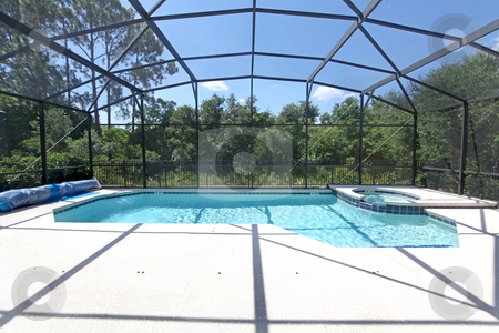 To use this stock image in your creative project, please select the size you need over to the right and click the "Add to Cart" button.
Your downloaded image will come with the Cutcaster watermark removed so don’t worry about the watermark you see on this page. Swimming Pool and Spa stock photo, A Swimming Pool and Spa overlooking Conservation by Lucy Clark