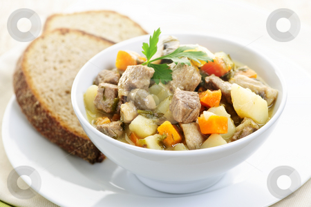 To use this stock image in your creative project, please select the size you need over to the right and click the "Add to Cart" button.
Your downloaded image will come with the Cutcaster watermark removed so don’t worry about the watermark you see on this page. Bowl of beef stew stock photo, Bowl of hearty beef stew with vegetables served with rye bread by Elena Elisseeva