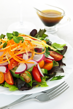 To use this stock image in your creative project, please select the size you need over to the right and click the "Add to Cart" button.
Your downloaded image will come with the Cutcaster watermark removed so don’t worry about the watermark you see on this page. Garden salad stock photo, Plate of healthy green garden salad with fresh vegetables served with balsamic dressing by Elena Elisseeva