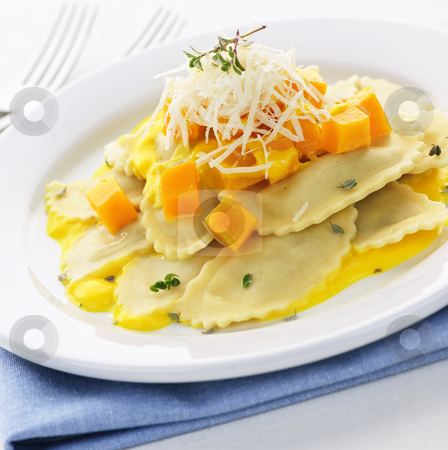 To use this stock image in your creative project, please select the size you need over to the right and click the "Add to Cart" button.
Your downloaded image will come with the Cutcaster watermark removed so don’t worry about the watermark you see on this page. Ravioli dinner stock photo, Gourmet squash ravioli dinner served with cheese on plate by Elena Elisseeva
