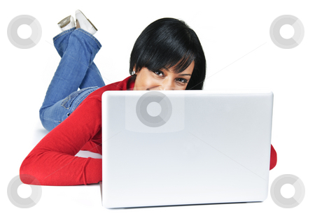 To use this stock image in your creative project, please select the size you need over to the right and click the "Add to Cart" button.
Your downloaded image will come with the Cutcaster watermark removed so don’t worry about the watermark you see on this page. Young woman with laptop computer stock photo, Smiling black woman peeking from behind computer laying on floor by Elena Elisseeva