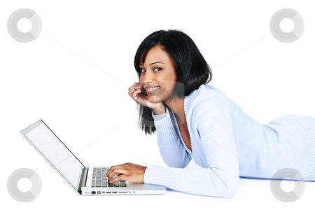 To use this stock image in your creative project, please select the size you need over to the right and click the "Add to Cart" button.
Your downloaded image will come with the Cutcaster watermark removed so don’t worry about the watermark you see on this page. Pretty young woman with computer stock photo, Smiling black woman using computer laying on floor looking at camera by Elena Elisseeva