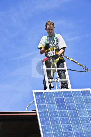 To use this stock image in your creative project, please select the size you need over to the right and click the "Add to Cart" button.
Your downloaded image will come with the Cutcaster watermark removed so don’t worry about the watermark you see on this page. Solar panel installation stock photo, Man installing alternative energy photovoltaic solar panels on roof by Elena Elisseeva
