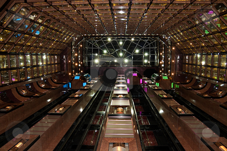 To use this stock image in your creative project, please select the size you need over to the right and click the "Add to Cart" button.
Your downloaded image will come with the Cutcaster watermark removed so don’t worry about the watermark you see on this page. Atrium stock photo, Large atrium with colorfully walls and elevators by Kevin Tietz