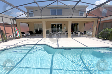 To use this stock image in your creative project, please select the size you need over to the right and click the "Add to Cart" button.
Your downloaded image will come with the Cutcaster watermark removed so don’t worry about the watermark you see on this page. Pool and Lanai stock photo, A Back Exterior of a Florida Home with Pool and Lanai by Lucy Clark