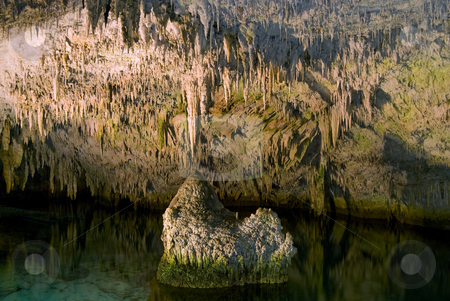 To use this stock image in your creative project, please select the size you need over to the right and click the "Add to Cart" button.
Your downloaded image will come with the Cutcaster watermark removed so don’t worry about the watermark you see on this page. Rock Iceberg stock photo, A rock in an underground cave, looking like an iceberg , in Bermuda. by Mary Lane