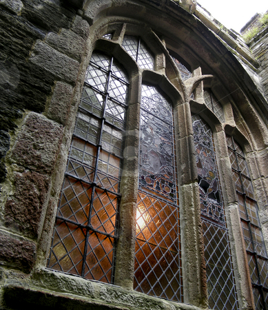 To use this stock image in your creative project, please select the size you need over to the right and click the "Add to Cart" button.
Your downloaded image will come with the Cutcaster watermark removed so don’t worry about the watermark you see on this page. Fowey Church Window stock photo, The light shining through this stained window makes a wonderful glow - Fowey, Cornwall, England by Mary Lane
