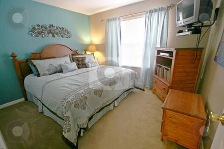 To use this stock image in your creative project, please select the size you need over to the right and click the "Add to Cart" button.
Your downloaded image will come with the Cutcaster watermark removed so don’t worry about the watermark you see on this page. King Bedroom stock photo, A King Bedroom, Interior Shot of a Home by Lucy Clark