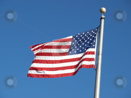 To use this stock image in your creative project, please select the size you need over to the right and click the "Add to Cart" button.
Your downloaded image will come with the Cutcaster watermark removed so don’t worry about the watermark you see on this page. American flag stock photo, An american flag flying in the breeeze by Tim Markley