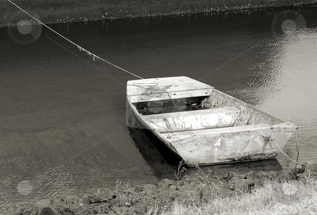 To use this stock image in your creative project, please select the size you need over to the right and click the "Add to Cart" button.
Your downloaded image will come with the Cutcaster watermark removed so don’t worry about the watermark you see on this page. Flat boat stock photo, Old boat along the shore in very poor condition shown in black and white by Tim Markley