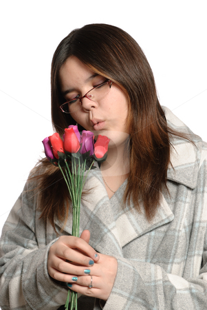 To use this stock image in your creative project, please select the size you need over to the right and click the "Add to Cart" button.
Your downloaded image will come with the Cutcaster watermark removed so don’t worry about the watermark you see on this page. Teen Holding Roses stock photo, A brunette teen is holding multicolored wooden roses, isolated against a white background. by Richard Nelson