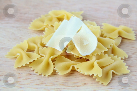 To use this stock image in your creative project, please select the size you need over to the right and click the "Add to Cart" button.
Your downloaded image will come with the Cutcaster watermark removed so don’t worry about the watermark you see on this page. Italian pasta on a wooden board wish cheese stock photo, by Olga Kriger