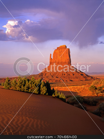 To use this stock image in your creative project, please select the size you need over to the right and click the "Add to Cart" button.
Your downloaded image will come with the Cutcaster watermark removed so don’t worry about the watermark you see on this page. East Mitten Butte stock photo, The East Mitten Butte in Monument Valley, Arizona. by Mike Norton