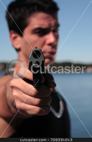 To use this stock image in your creative project, please select the size you need over to the right and click the "Add to Cart" button.
Your downloaded image will come with the Cutcaster watermark removed so don’t worry about the watermark you see on this page. Armed 3 stock photo, A young man, wearing a sleeveless shirt, holding a hand gun. (This image is part of a series) by Daniel Wiedemann