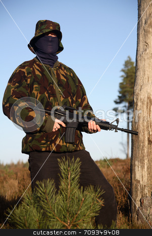 To use this stock image in your creative project, please select the size you need over to the right and click the "Add to Cart" button.
Your downloaded image will come with the Cutcaster watermark removed so don’t worry about the watermark you see on this page. Soldier with Camouflage (standing) stock photo, A soldier holding a M16 (AR-15) Rifle with camouflage and a balaclava. by Daniel Wiedemann