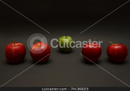 To use this stock image in your creative project, please select the size you need over to the right and click the "Add to Cart" button.
Your downloaded image will come with the Cutcaster watermark removed so don’t worry about the watermark you see on this page. Odd One Out stock photo, A line of apples, with one red one out. by Daniel Wiedemann