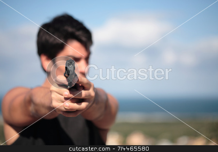 To use this stock image in your creative project, please select the size you need over to the right and click the "Add to Cart" button.
Your downloaded image will come with the Cutcaster watermark removed so don’t worry about the watermark you see on this page. Shooter stock photo, A young, robust man, in his 20's with dark hair pointing 2 pistols to the camera. by Daniel Wiedemann