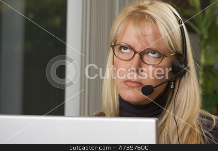 To use this stock image in your creative project, please select the size you need over to the right and click the "Add to Cart" button.
Your downloaded image will come with the Cutcaster watermark removed so don’t worry about the watermark you see on this page. Attractive Businesswoman with Phone Headset stock photo, Attractive businesswoman shows signs of boredom while on her phone headset. by Andy Dean
