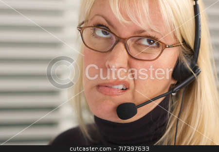 To use this stock image in your creative project, please select the size you need over to the right and click the "Add to Cart" button.
Your downloaded image will come with the Cutcaster watermark removed so don’t worry about the watermark you see on this page. Attractive Businesswoman with Phone Headset stock photo, Attractive businesswoman talks on her phone headset. by Andy Dean