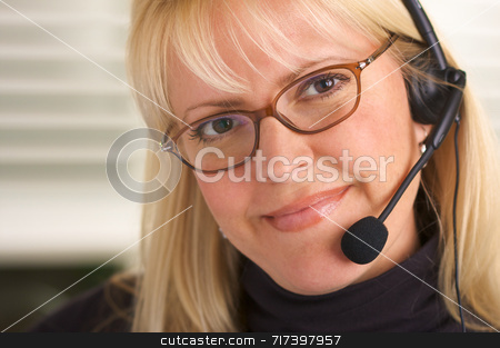 To use this stock image in your creative project, please select the size you need over to the right and click the "Add to Cart" button.
Your downloaded image will come with the Cutcaster watermark removed so don’t worry about the watermark you see on this page. Attractive Businesswoman with Phone Headset stock photo, Attractive businesswoman talks on her phone headset. by Andy Dean