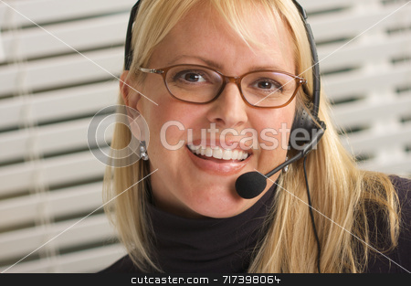 To use this stock image in your creative project, please select the size you need over to the right and click the "Add to Cart" button.
Your downloaded image will come with the Cutcaster watermark removed so don’t worry about the watermark you see on this page. Attractive Businesswoman with Phone Headset stock photo, Attractive businesswoman talks on her phone headset. by Andy Dean