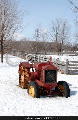 To use this stock image in your creative project, please select the size you need over to the right and click the "Add to Cart" button.
Your downloaded image will come with the Cutcaster watermark removed so don’t worry about the watermark you see on this page. Old Tractor stock photo, A vintage tractor sitting in a snowy field by Maria Bell