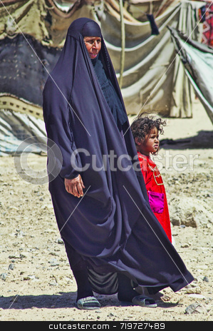 To use this stock image in your creative project, please select the size you need over to the right and click the "Add to Cart" button.
Your downloaded image will come with the Cutcaster watermark removed so don’t worry about the watermark you see on this page. Bedouin mother and child stock photo, Photo taken in the desert of Muthanna, southern Iraq. by Stefan Edwards