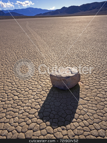 To use this stock image in your creative project, please select the size you need over to the right and click the "Add to Cart" button.
Your downloaded image will come with the Cutcaster watermark removed so don’t worry about the watermark you see on this page. Rock motion stock photo, A rock and its trail on the Racetrack Playa in Death Valley National Park, California. by Mike Norton